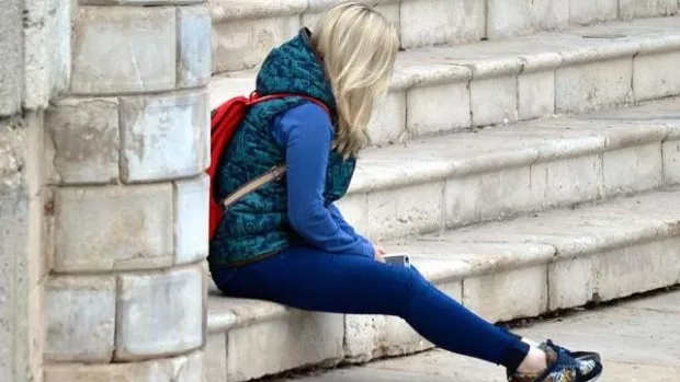 A photo representing a woman with MS struggling with stress and anxiety