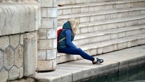 Woman sitting on steps