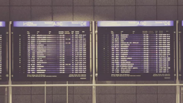 a photo of an airport departure board