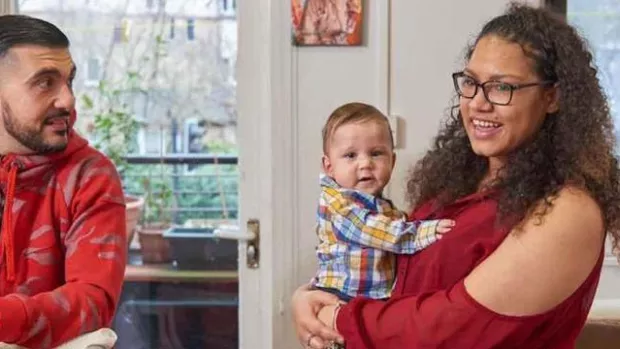 Photo: couple at home with baby