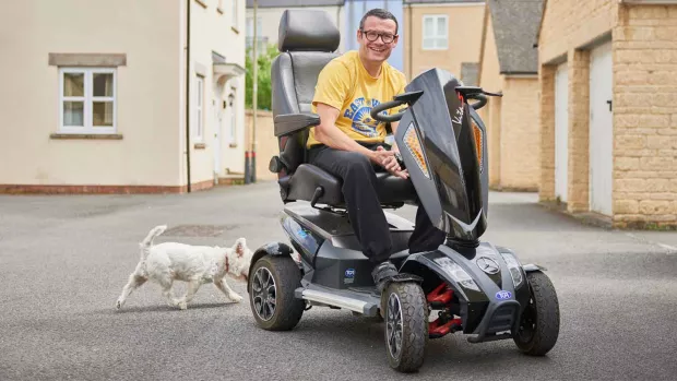 Man with ms on scooter