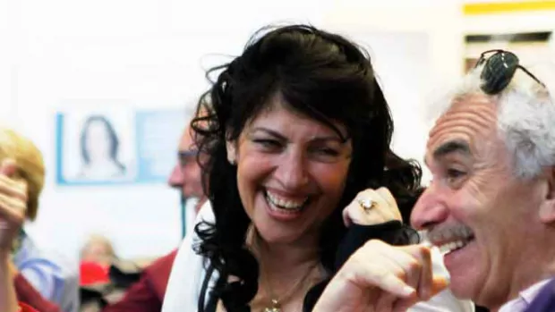 Photo shows a group of four people enjoying themselves at an MS Society event.