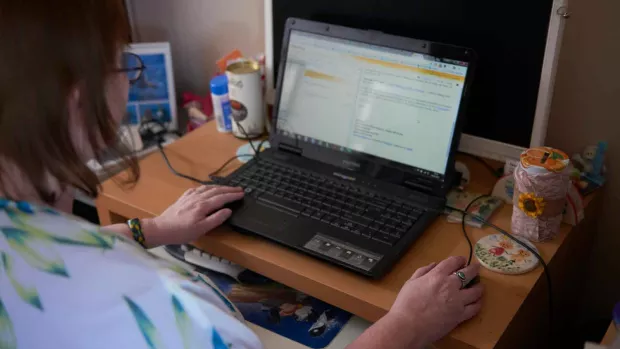 photo of a Woman working on a laptop 