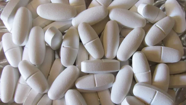 White vitamin pills