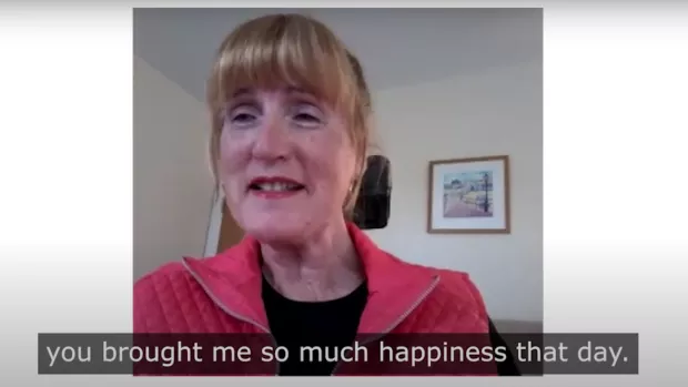 Image is a screenshot from a video. It shows Pam on camera and the subtitles say 'you brought me so much happiness that day'.