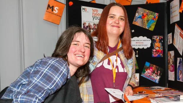 Karine and her wife Sarah at an MS Society information stand