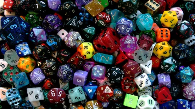 many different sized, coloured and sided dice