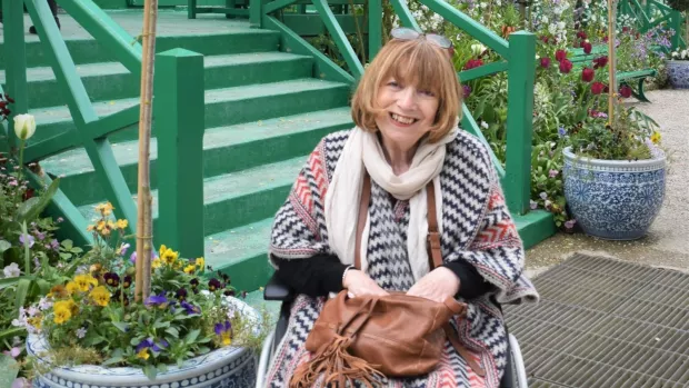 Carol using her wheelchair on holiday in France.