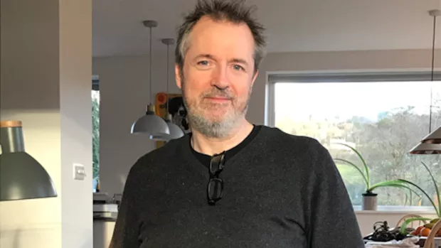 Miles in a dark grey top