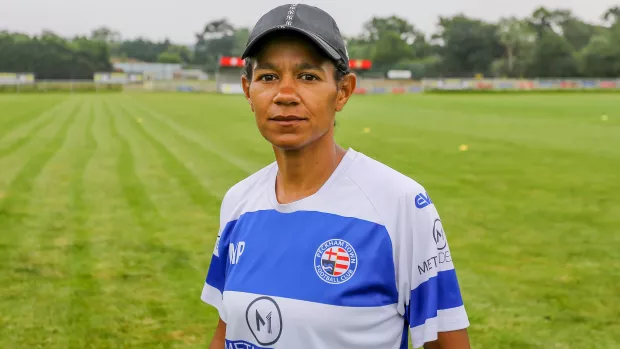 Photo of Mary Phillip in a blue and white football jersey