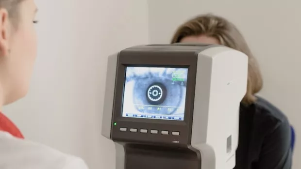 A person has their eyes examined