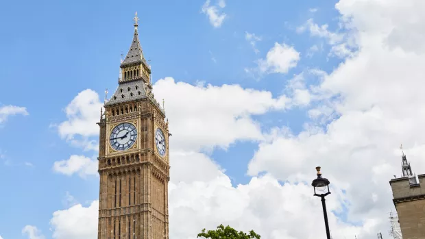 House of commons against blue sky with clouds