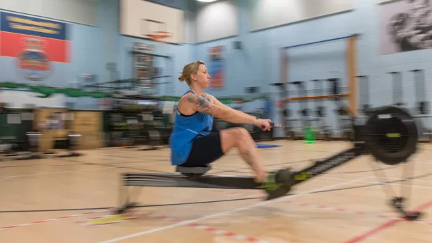 Stacy training on a rowing machine