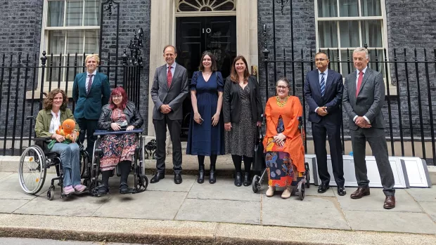 A group of people in front of 10 Downing Street