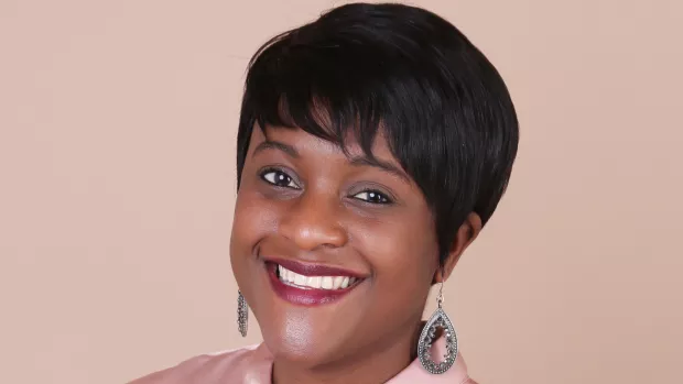 Headshot of Simone Bell, smiling