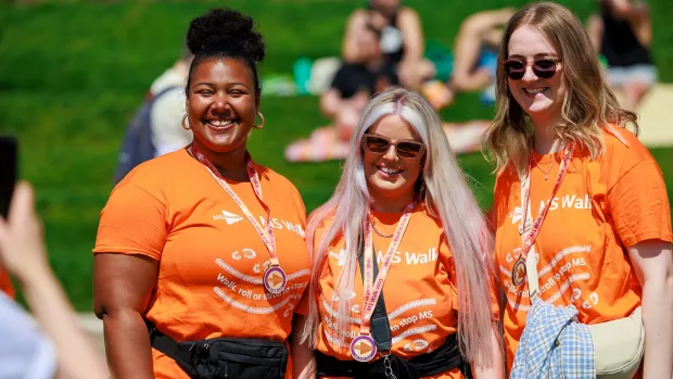 A group of MS Society supporters wearing MS Walk t-shirts