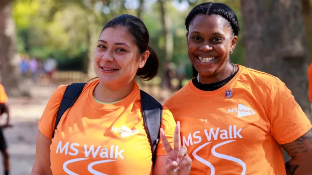 Two MS Society fundraisers wearing MS Walk t-shirts