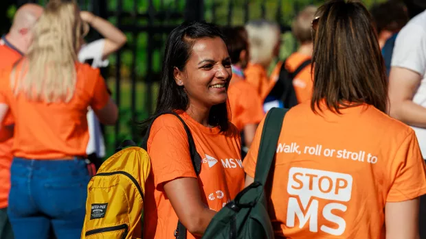 A woman wearing an MS Society t-shirt at an MS Walk event