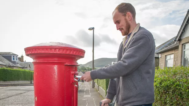 Person posting a letter