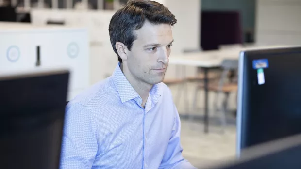 A man working on a computer in an office