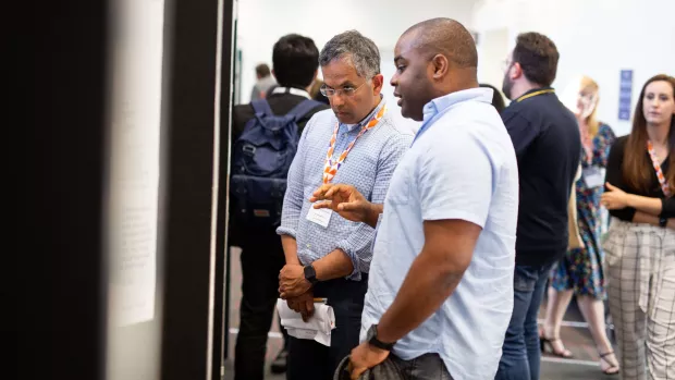 Two delegates talking to eachother at an MS conference