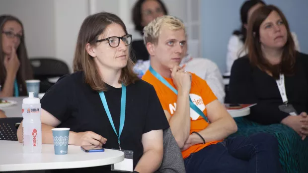 a group of delegates concentrating at an MS Society event