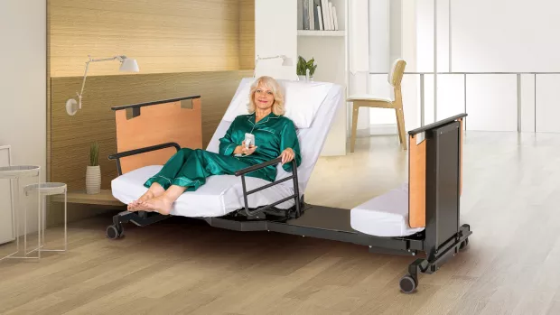 Photo showing a woman using a theraposture bed