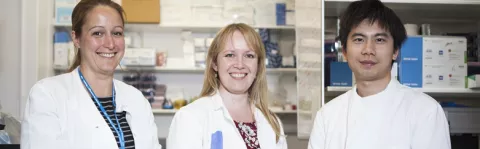 photo: three scientists in lab coats