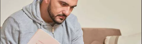 Applying for PIP - Men reading