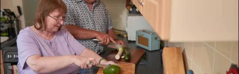 a photo of a Couple cooking in the kitchen