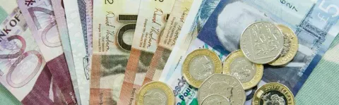 A photo showing Euro coins and notes