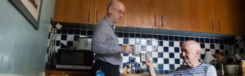 a photo of two Men in a kitchen