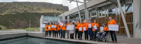 A group of MS campaigners outside the Scottish Parliament