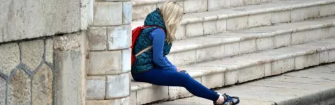 A photo representing a woman with MS struggling with stress and anxiety