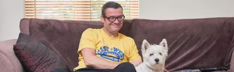 Man sat on sofa