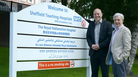 Photo: HSCT researchers Professor Basil Sharrack and Professor John Snowden standing outside Sheffield's Royal Hallamshire Hospital