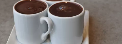 image shows mugs of hot chocolate