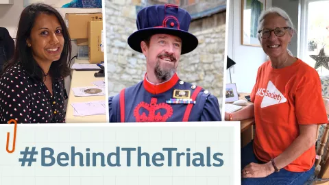 Image shows 3 people. Anisha, sitting at her desk at work. Andy, dressed as a beefeater, and Jacqueline, sitting at her desk at home. They are linked by text saying hashtag behind the trials, presented to look like piece of paper clipped on with a paperclip.