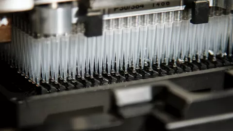 a photograph of a machine with lots of pipettes