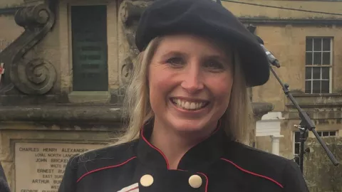 Photo shows Stephanie Millward smiling, in her official dress as Deputy Lieutenant for Wiltshire.