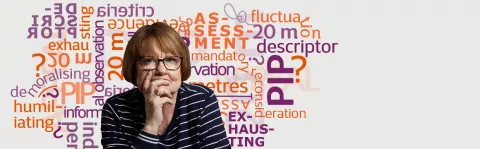 A woman sits with her head in her hand with a wall of PIP-related words behind her