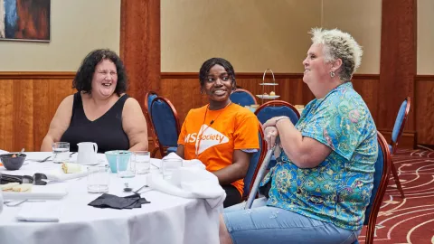 Local group members chatting at an MS Society event