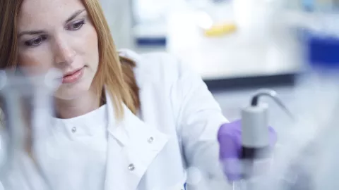 Close up of a researcher working in a lab