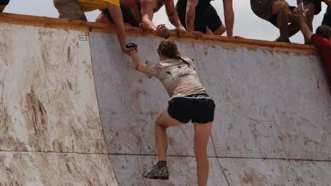 A woman taking part in an obstacle race