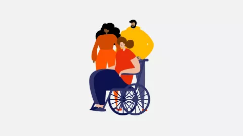 A group of three people, one in a wheelchair and two standing