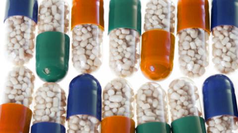 An image of brightly coloured medication pills
