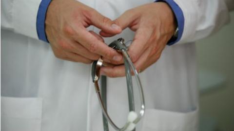 Stethoscope in clinicians hands